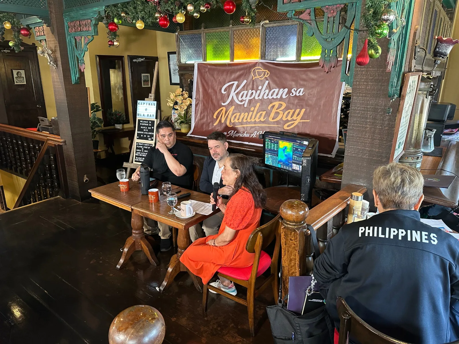 Jason Keith V. Boñaga of CrisisOps and Dr. Chad Michael Briggs of AIM speaking at the Kapihan sa Manila Bay by Marichu Villanueva press forum about Physical AI and Super El Niño preparedness.