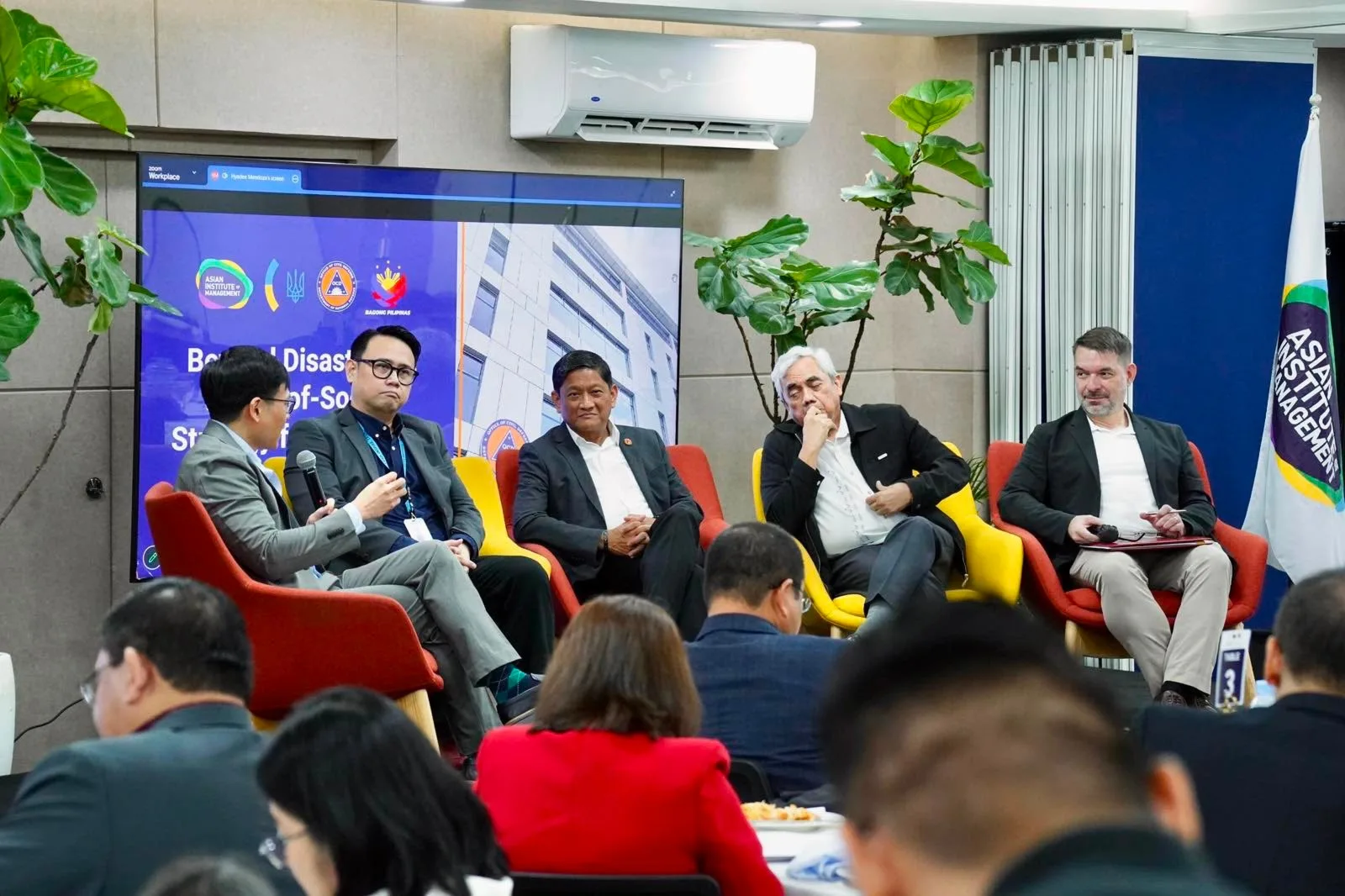 Forum speakers take part in a panel discussion during BEYOND DISASTERS at the Asian Institute of Management, focusing on Philippine civil defense, disaster resilience, and operational intelligence.